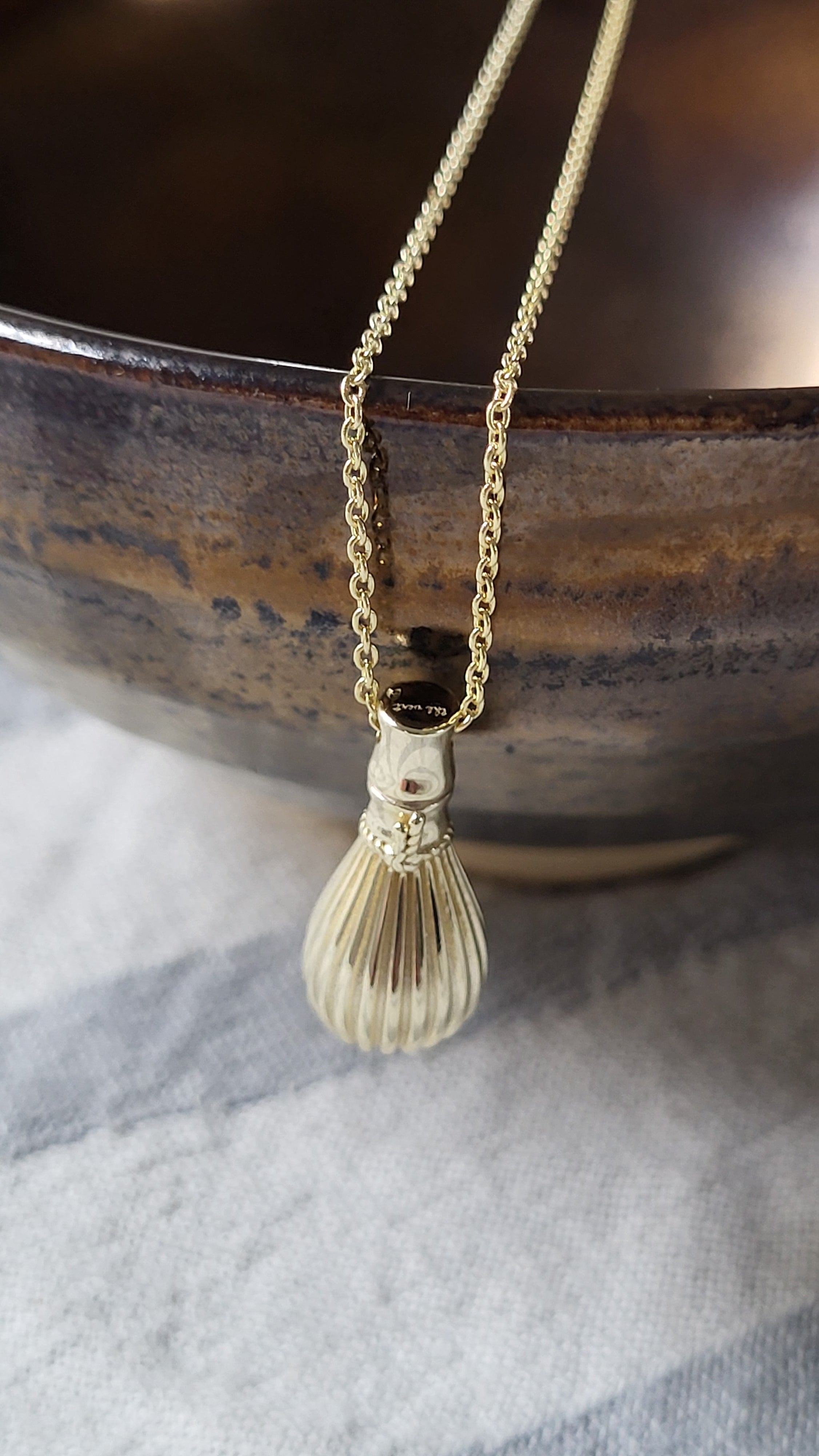 The Sana Matcha Whisk Necklace in Gold