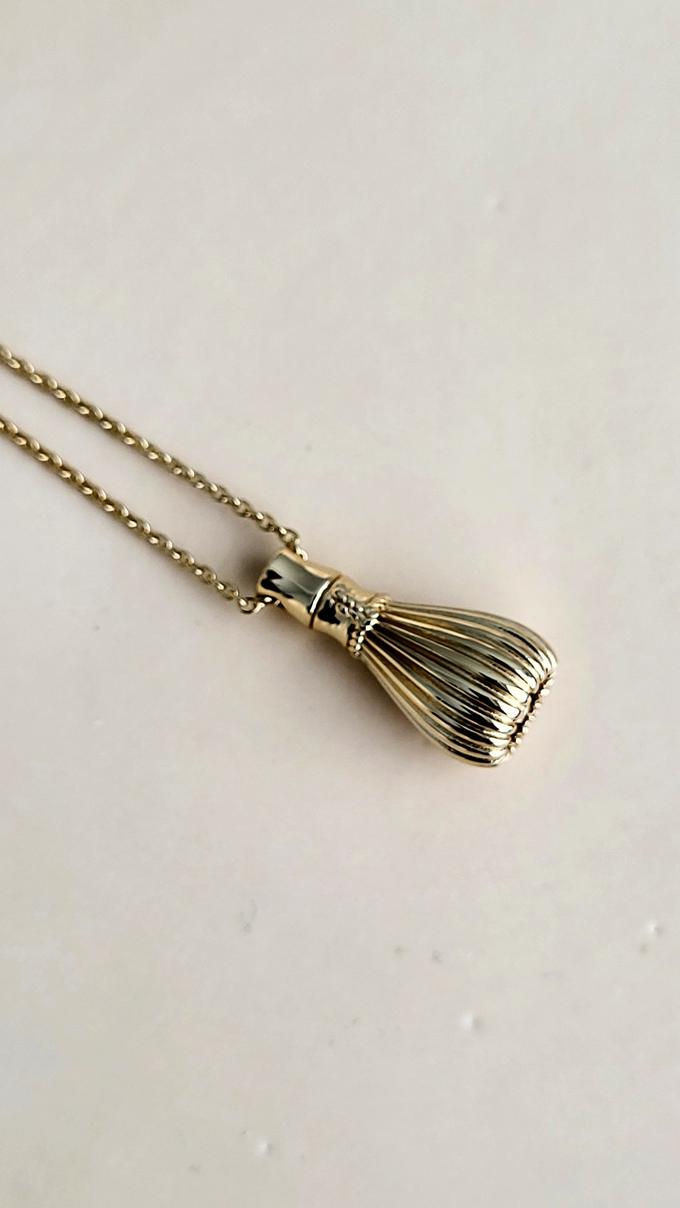 The Sana Matcha Whisk Necklace in Gold
